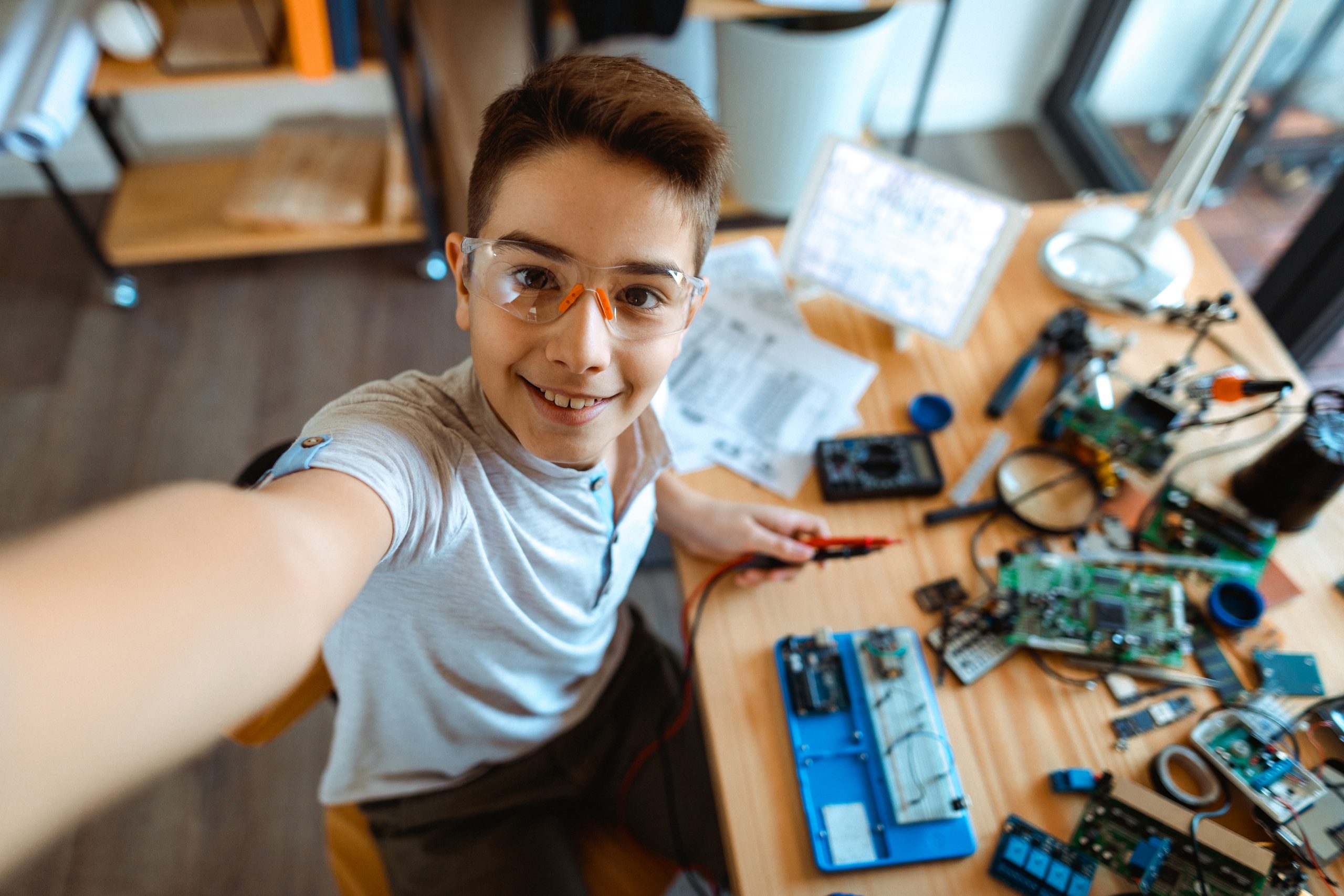 Selfie Photo of boy electrician takes selfie in laboratory